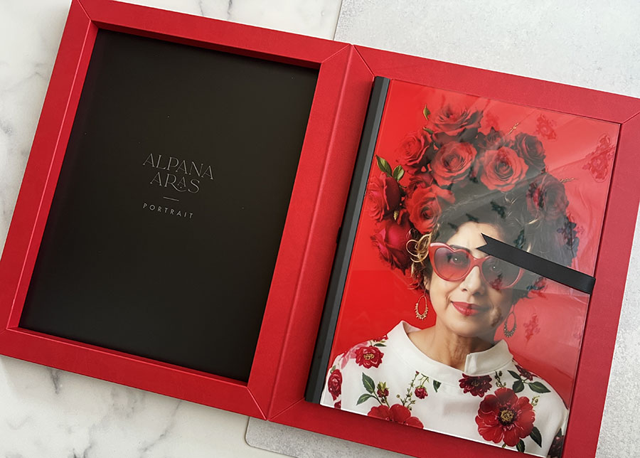 alpana holding baby in carrier on back